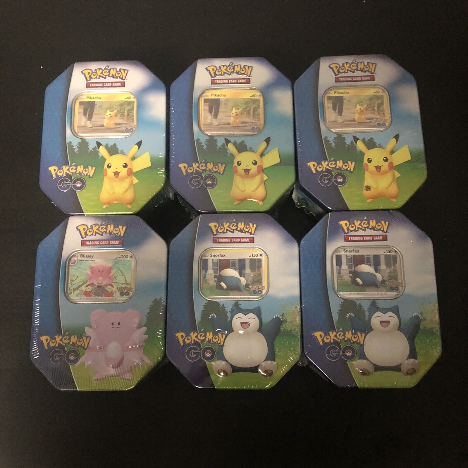 Lot Of 6 Pokemon Tcg Pokemon Go Tin 3 Pikachu, 1 Blissey, 2 Snorlax